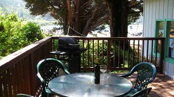 Enjoy al fresco dining and socializing on this deck with a barbecue grill and comfortable seating.