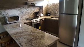 Fridge, microwave, stovetop, coffee/tea maker
