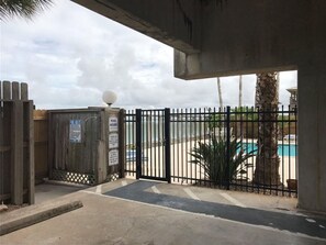 Enter a tranquil oasis, where a secure gate leads to a refreshing pool area.