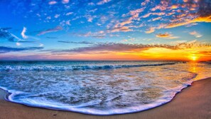 A beach with waves and a sunset. - Oceanfront 3BR Condo, Top/Third Floor, Heated Pool, Ocean Club, Indian Beach (Indian Beach)
