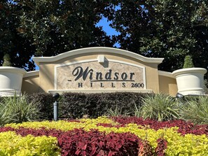Welcome to Windsor Hills, a residential area marked by a sign on a decorative arch.