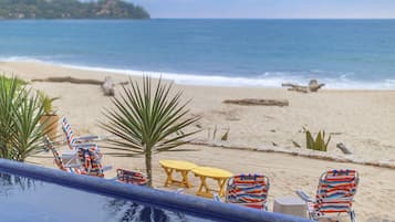On the beach, sun loungers, beach towels