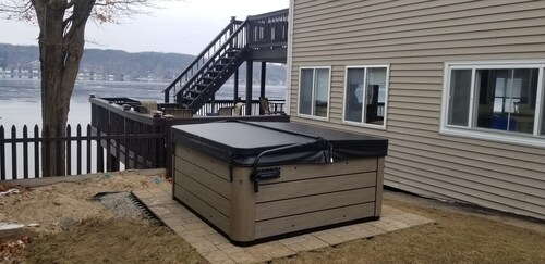 4 season escape boasts 5 beds and now a HOT TUB to enjoy any time of year!