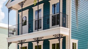 A two-story house with a balcony, large windows, and a front porch. - The Guesthouse at The Waters, Walk to Chapel, Pool & Town Square (Pike Rd)
