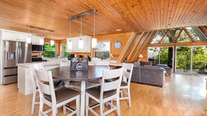 A spacious kitchen with white cabinetry, a central island, and hanging pendant lights. - 4 Bedrooms, Heated Private pool, hot tub, Game room, and Water Front View! (Monticello)