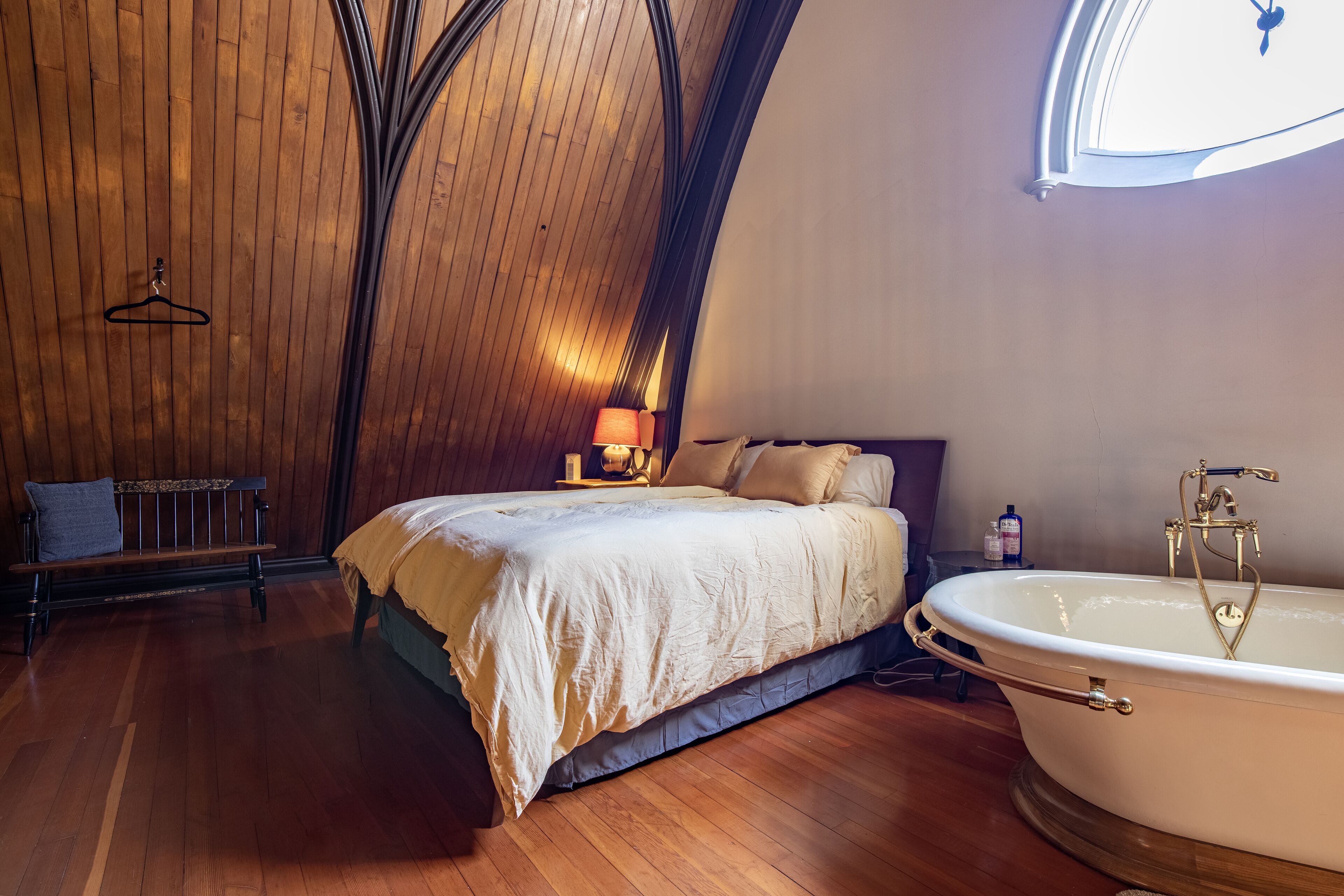 View of choir loft bedroom with soaking tub
