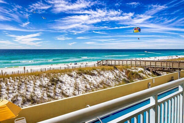 A beach view with a wooden boardwalk, a sandy beach, and the ocean. - Pelican Isle – Gulf Front Gem, Granite, Free Beach Service, New Sofa Sleeper (Fort Walton Beach)