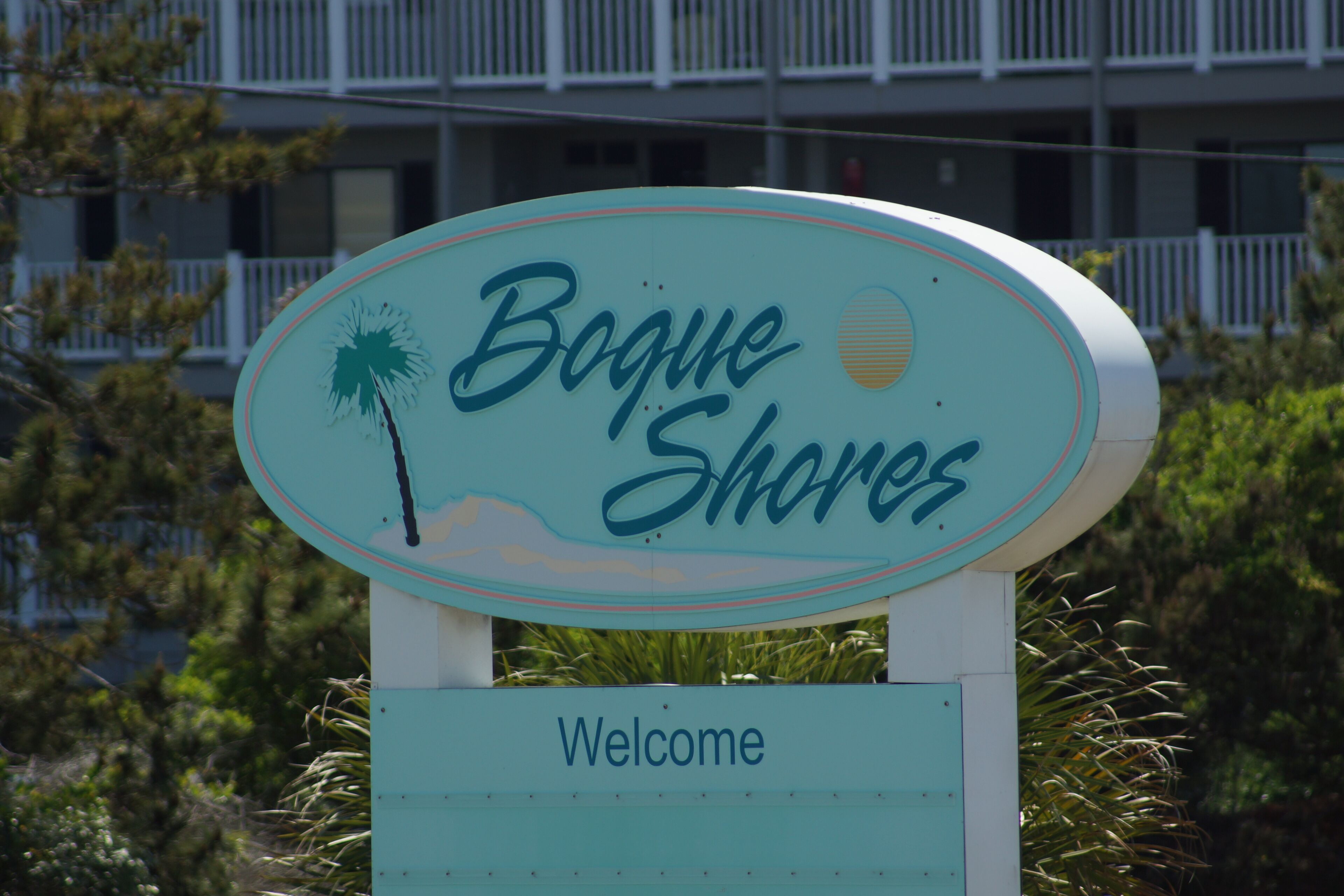 A sign with the text "Bogue Shores Welcome".
