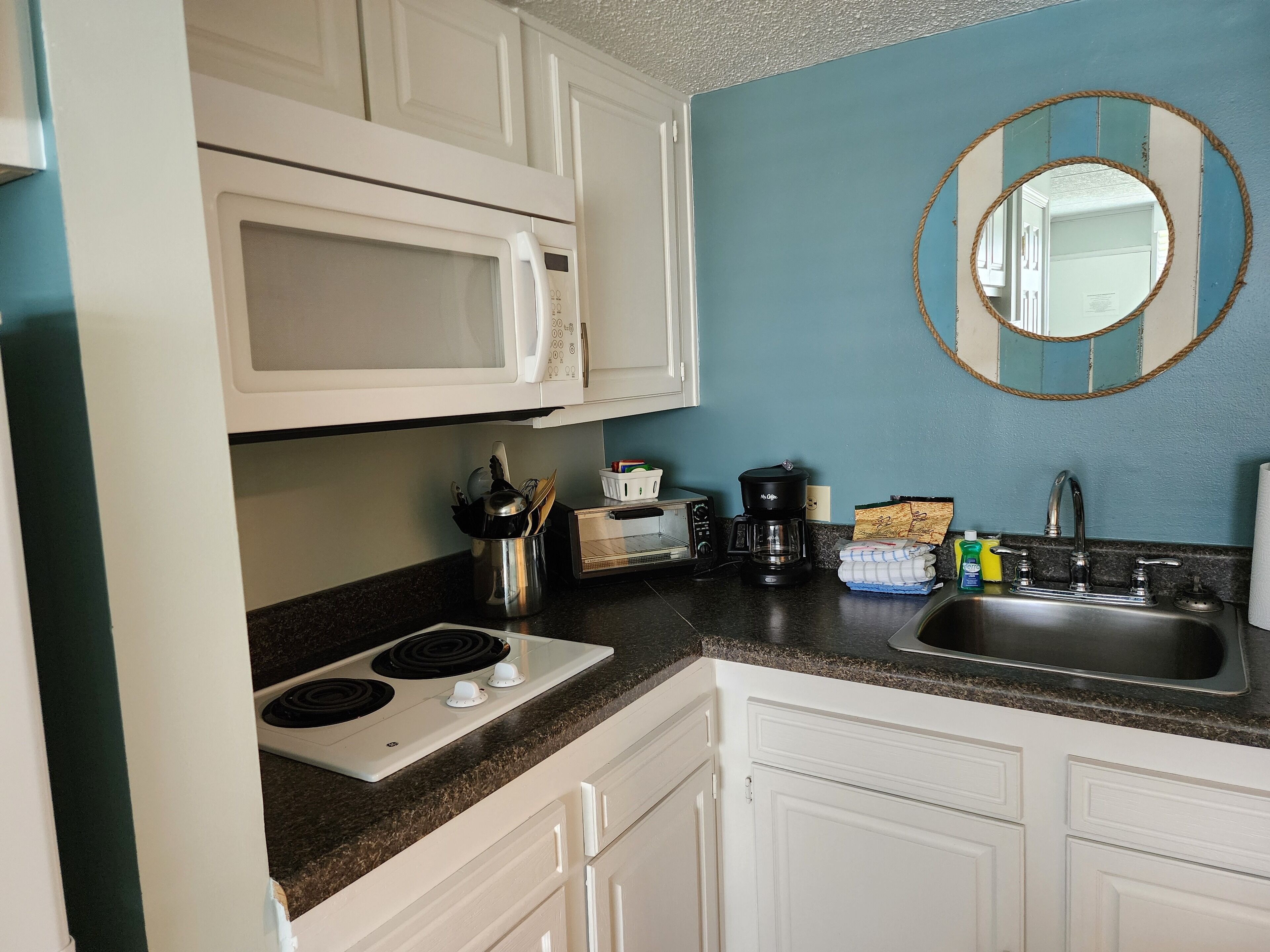 Fridge, microwave, coffee/tea maker, toaster