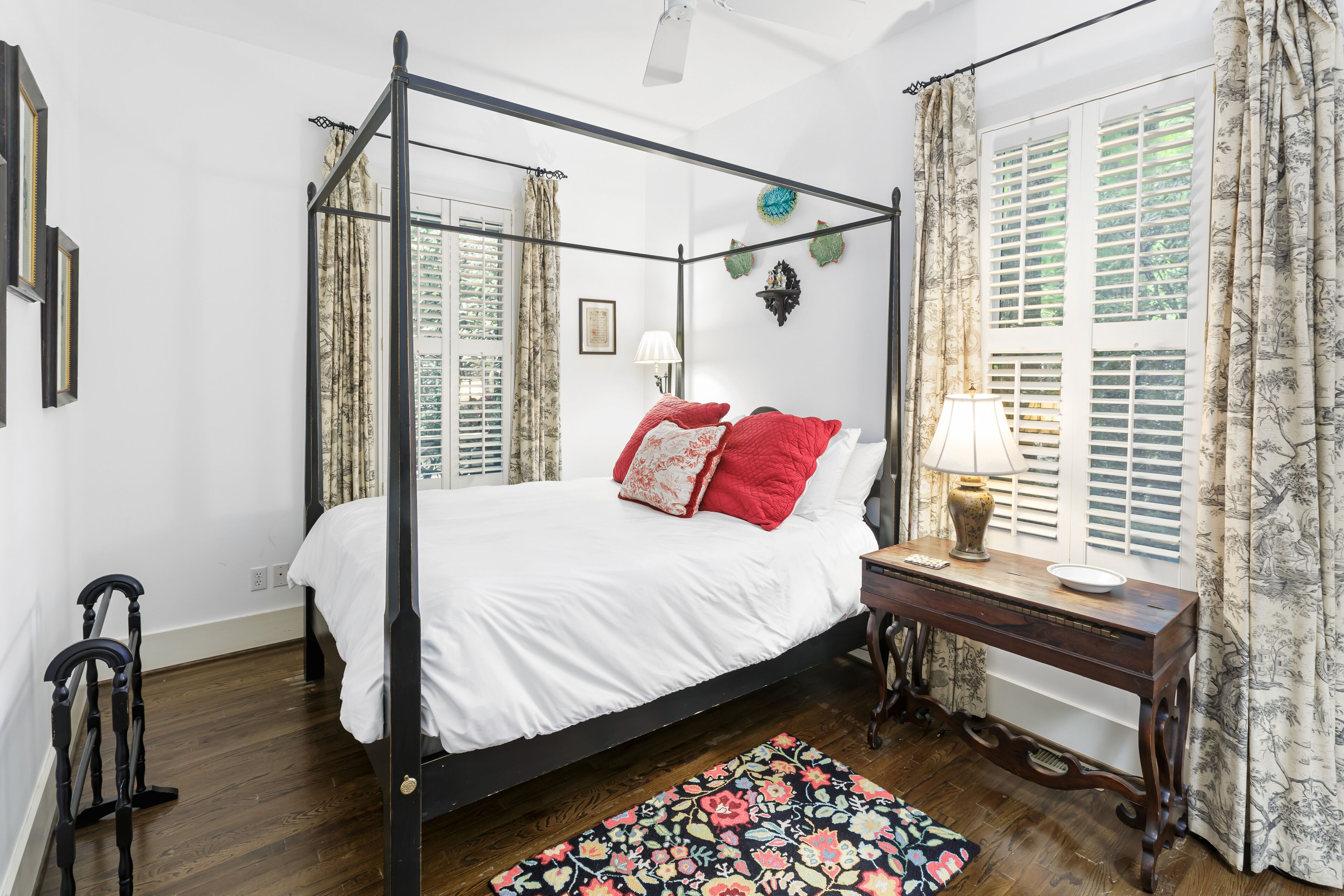 Primary bedroom #2 on main level features fresh white linens and duvet