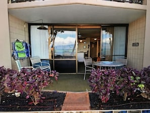 Enjoy the ocean view from your balcony with a table and chairs.