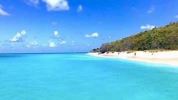 On the beach, sun-loungers, beach towels