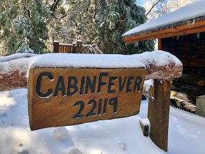 Escape to CABINFEVER 22119, a cozy cabin nestled among the trees.