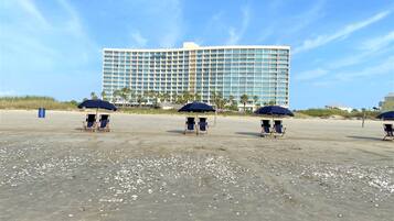 On the beach, sun loungers, beach towels