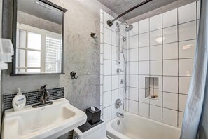 Combined shower/tub, hair dryer, towels, soap