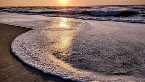A beach with waves and a sunset. - “BEACHFRONT ELM” IS CALLING
~Oceanfront~Private Beach Access~Pool~ (Carolina Beach)