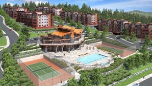 A multi-story residential building with a central courtyard, tennis courts, and a swimming pool. - Lake View! Resort Style living. Short term rentals are allowed  at this complex. (Westbank, Kelowna)