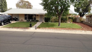 Stroll through the beautifully landscaped garden and enjoy the serene atmosphere of this single-story home.