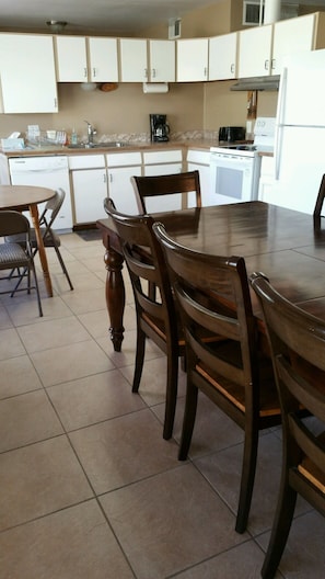 Enjoy meals in this kitchen with an oven, microwave, and dining table for four.