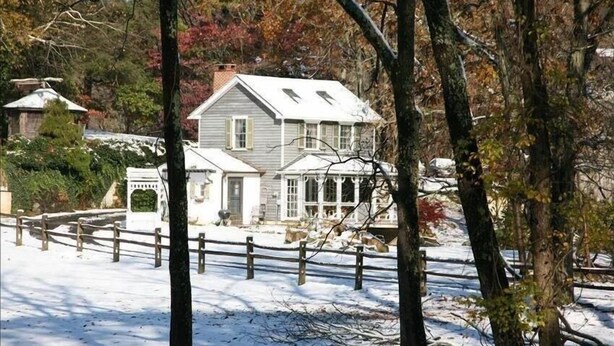 A snow-covered landscape with a house surrounded by trees. - Cottage on Historic Gentleman's Farm (Chester Springs)