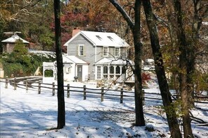A snow-covered landscape with a house surrounded by trees. - Cottage on Historic Gentleman's Farm (Chester Springs)