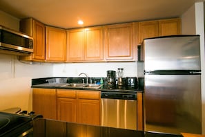 Kitchen with stainless steel appliances and granite counters