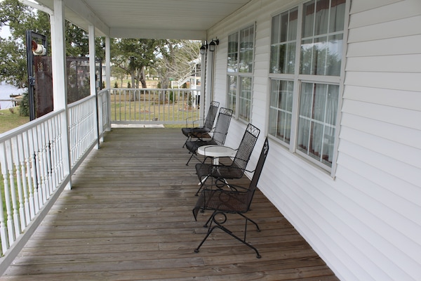 Covered porch overlooks the Bay of St Louis.