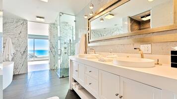 Bathtub, hair dryer, towels, soap