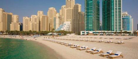On the beach, sun loungers