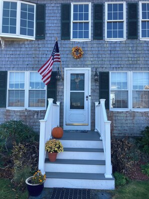 A house with a front porch, a white door, and a number '36' on the wall. - Town Neck Beach , Sandwich, MA, Cape Cod. Treehouse Brewery, marina, cc canal. (Sandwich)