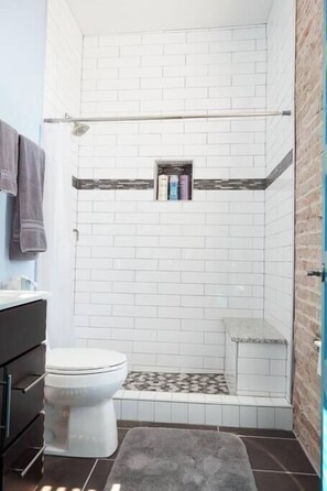 Shower, hair dryer, towels, shampoo