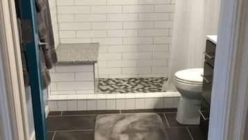 Shower, hair dryer, towels, shampoo