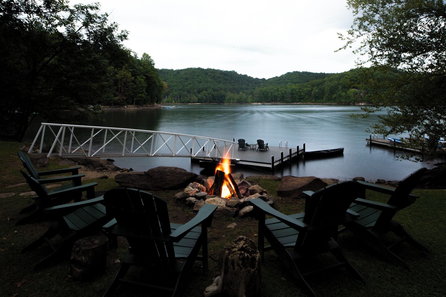 Lakeside fire pit with seating for 6. Perfect for s'mores.
