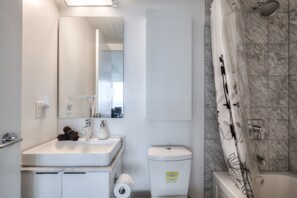 Combined shower/bathtub, hair dryer, towels - 50th+ floor lake view condo beside CN tower (Old Toronto)