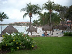 On the beach, sun loungers, beach towels