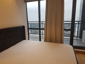 Enjoy a city view from the comfort of this stylish room, featuring a single bed and large window with a partial view of the city.