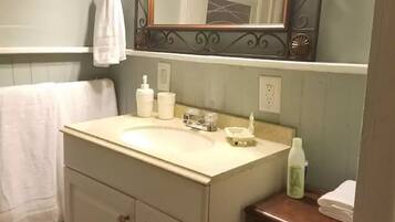 Bathtub, hair dryer, towels, soap