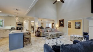 A spacious living area with a high ceiling, a dining area, and a kitchen. - 3rdRowOcean Palmetto Dunes Dog Friendly Home w/ FREE Pool/Spa Heat Seasonally (Hilton Head Island)
