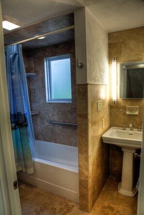 Combined shower/tub, hair dryer, towels, soap