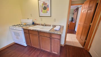 Fridge, microwave, coffee/tea maker, cookware/dishes/utensils