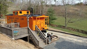 A stationary train engine with a platform and stairs, labeled 'SEABOARD COAST LINE.'