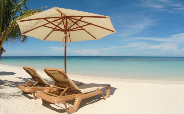 On the beach, sun-loungers, beach towels