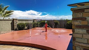 A red fire hydrant in a circular water feature with a clear blue sky in the background. - 5 Bedrooms with Heated Private Pool, Last minute rates are posted! (Saint George/Washington)