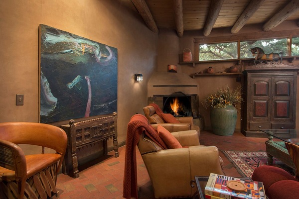 Fireplace and elegant leather chairs create a congenial Great-Room.