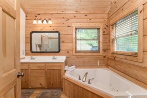 Bathtub, jetted bath, hair dryer, towels