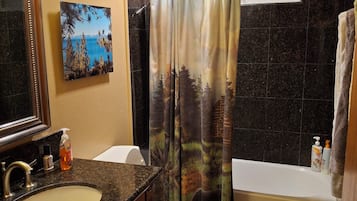 Combined shower/tub, hair dryer, towels, soap
