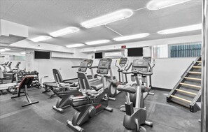 A gym with various exercise equipment, including treadmills and weight machines. - Waikiki Hotel Studio @ Hawaiian Monarch Building 1 day min (Honolulu)