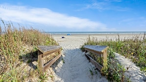 A sandy beach path with wooden benches leading to the ocean. - IDEAL Location at Windswept, 3BD Villa, Walk-Out to Beach! (Kiawah Island)