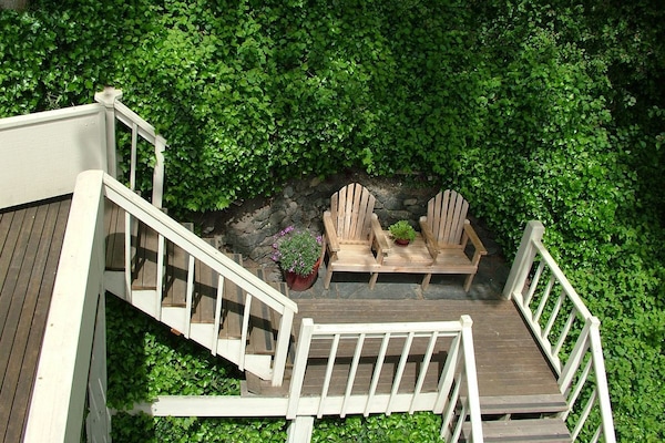 Secluded nook with bench on stairs to penthouse.