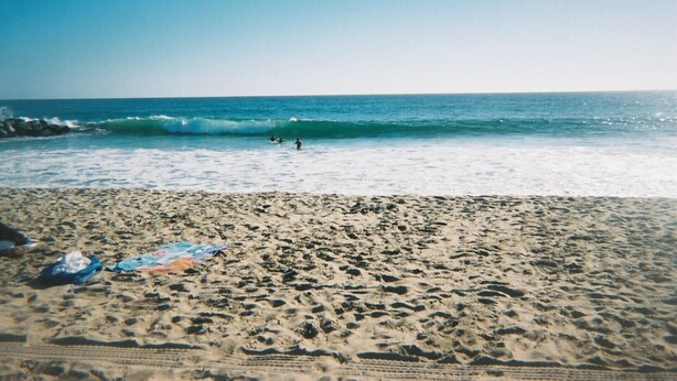 A beach with waves, a clear sky, and a sandy shore. - Seashore Dr - 12 Bikes, 10 Boards, 8 Wetsuits, 11 Beach Chairs & Beach Toys - (Newport Beach)